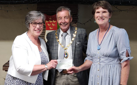 Photo of the Mayor handing over a cheque